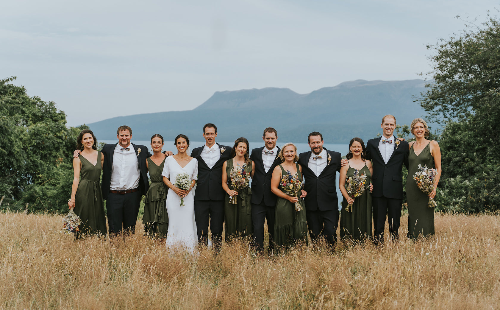 BRIDAL-PARTY-STANDING-IN-TUSSOCK-GRASS
