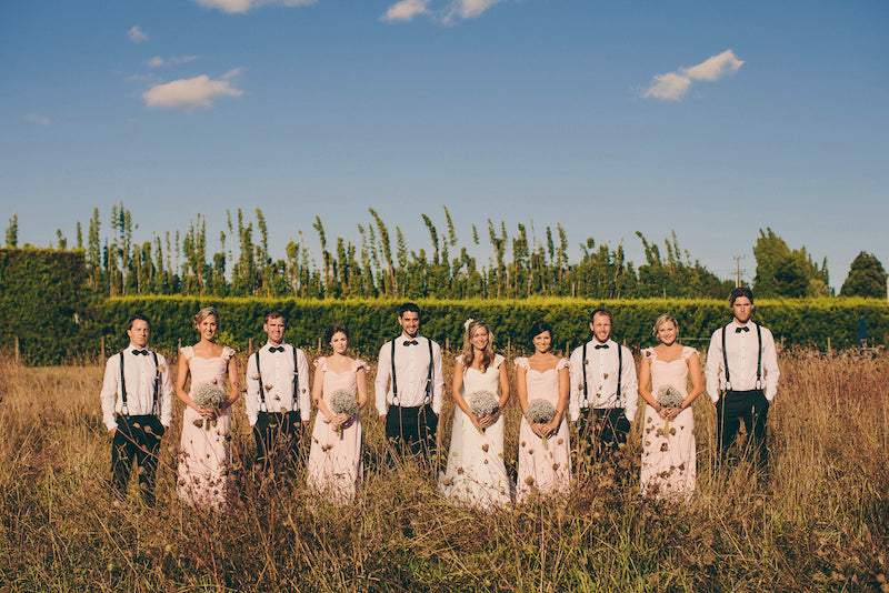 BRIDAL-PARTY-STANDING-IN-TUSSOCK-FIELD