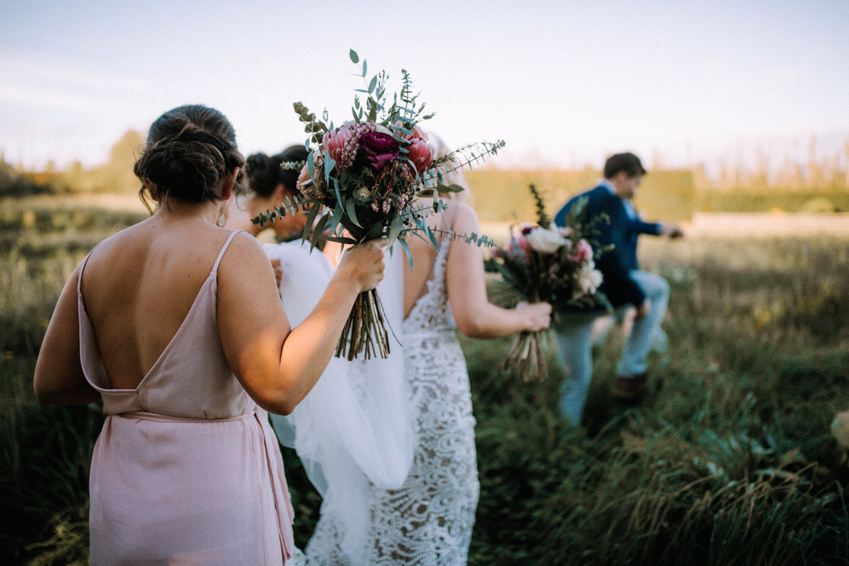 BRIDAL-PARTY-WALKING-TUSSOCK-GRASS