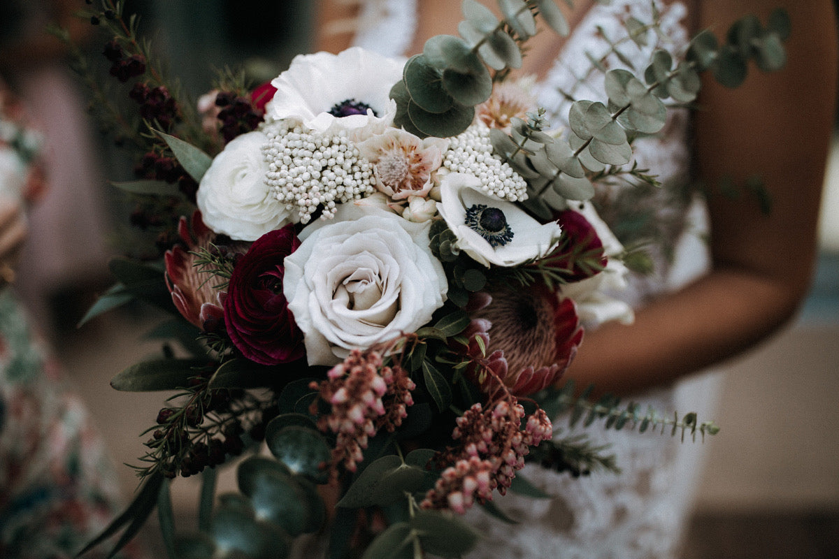 RUSTIC-MOODY-BRIDE-HOLDING-BOUQUET