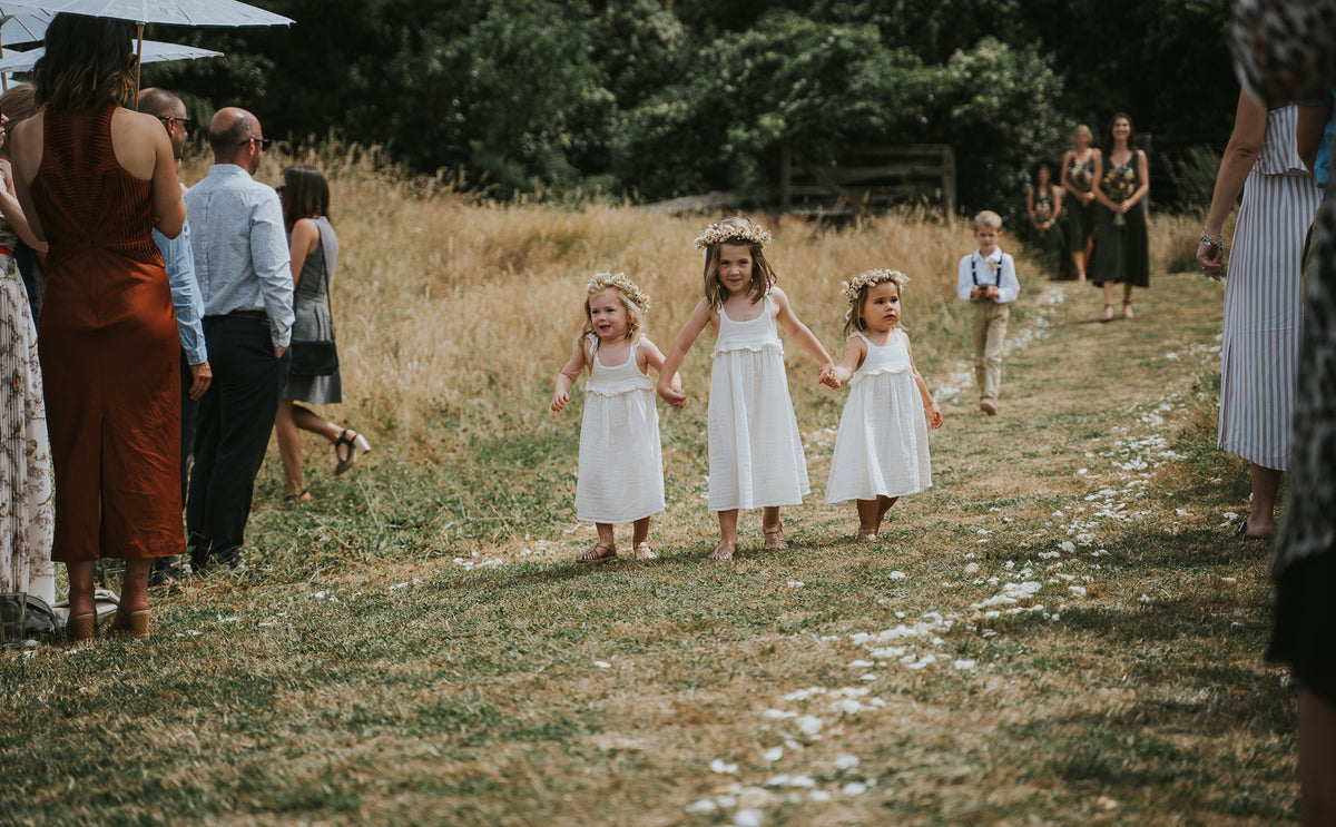 THREE-FLOWER-GIRLS-WALKING-DOWN-AISLE