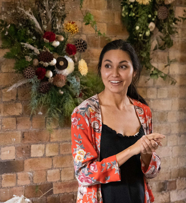 NADIA-LIM-PRESENTING-AT-MEADOW-EVENT-WITH-BOTANICS-WALL-INSTALLATION-BEHIND