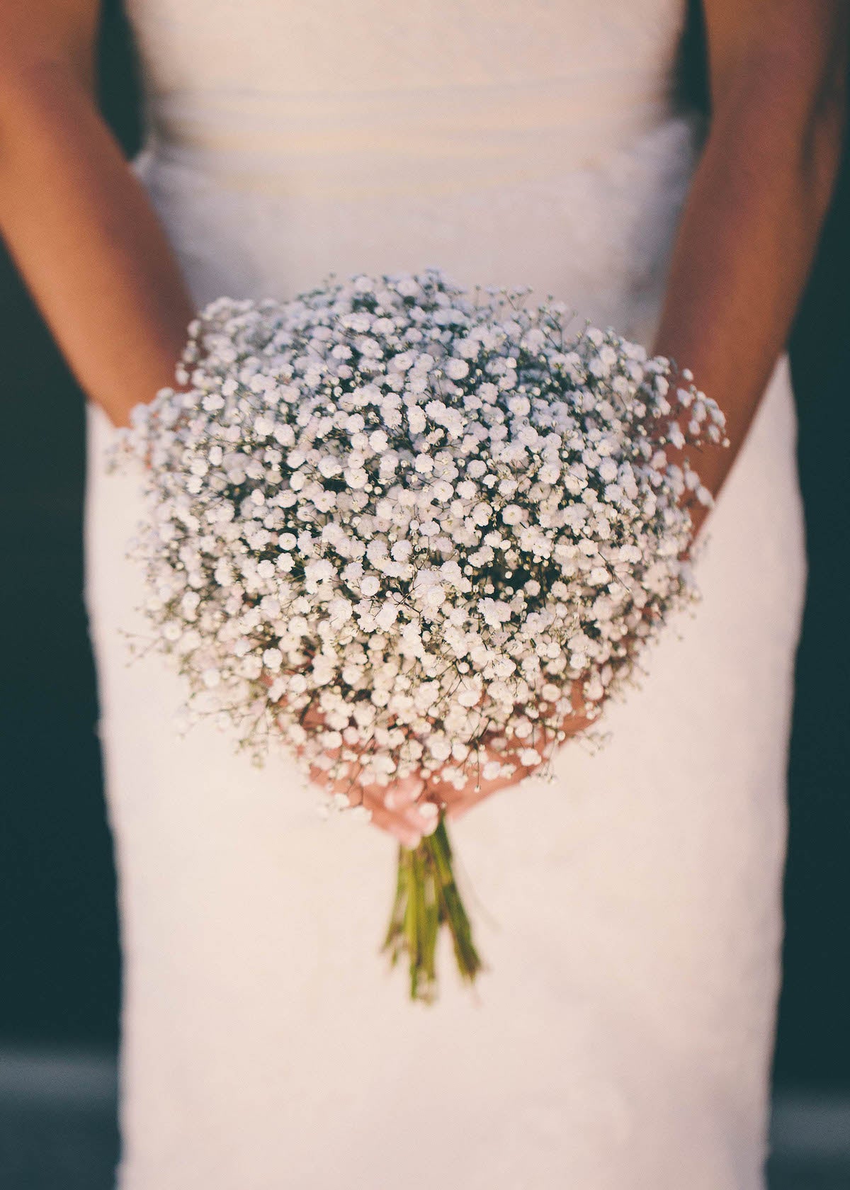 BRIDE-HOLDING-WHITE-BOUQUET