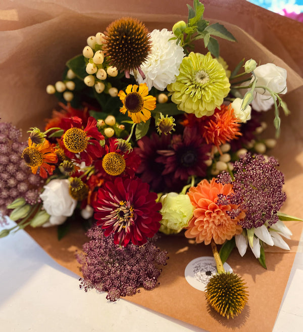 Botanics-rustic-warm-flower-bouquet-wrapped-in-brown-paper