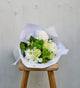 Botanics-white-green-flower-bouquet-staged-on-wooden-stool
