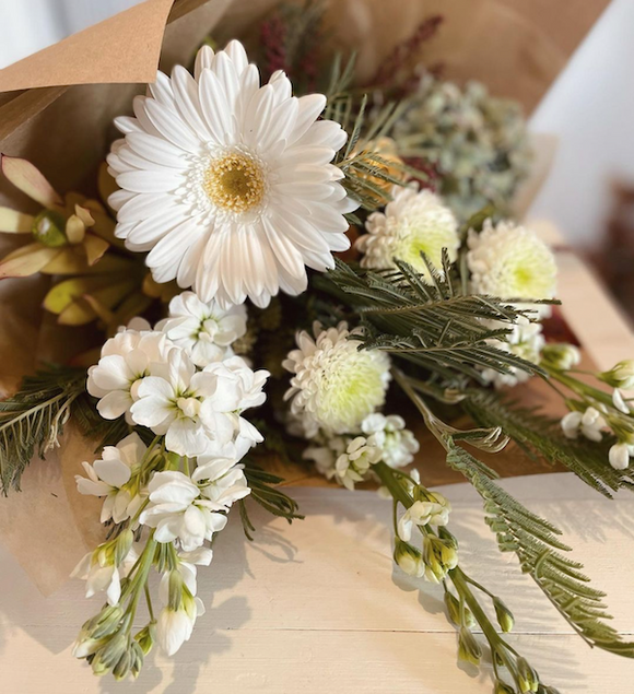 Botanics-white-green-bouquet-wrapped-in-brown-paper