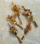 Mini-petite-dried-flower-bunches-laid-out-on-concrete